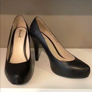 Black leather pumps